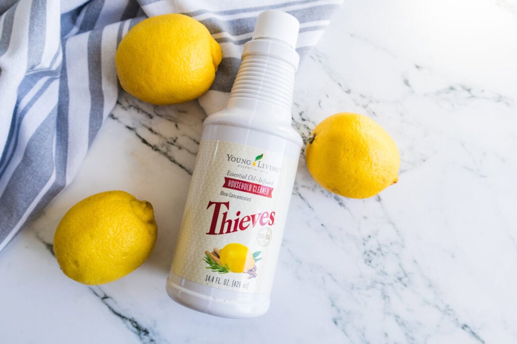 thieves on counter next to lemons and gray towel