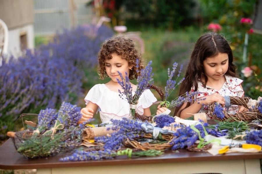 two girl making a lavender wreath
