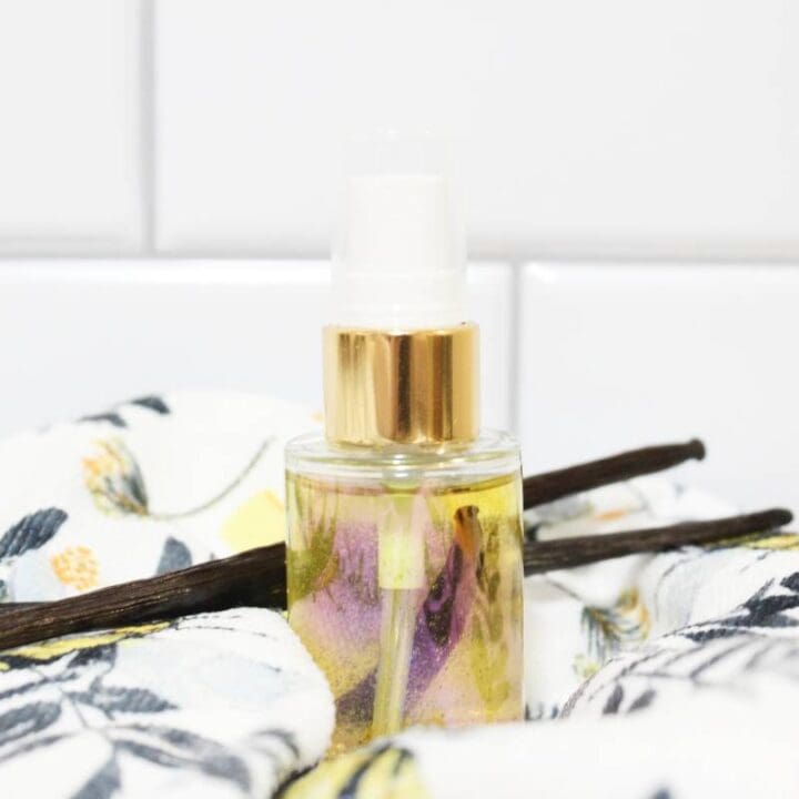 vanilla perfume oil in bottle with vanilla beans