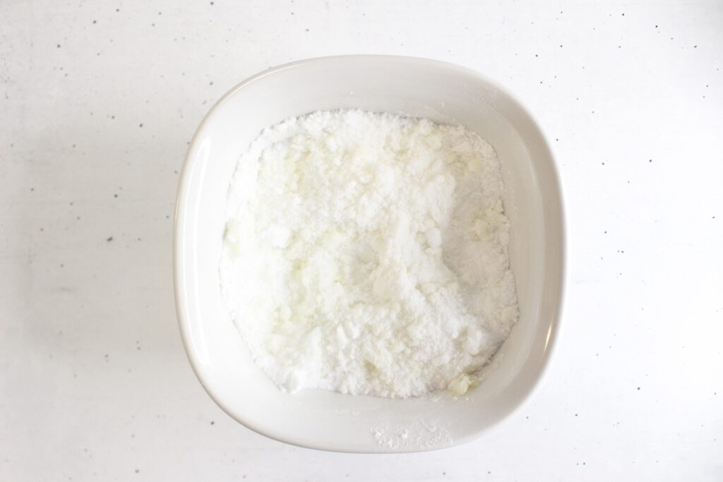 mixing the baking soda, citric acid, and infused oil