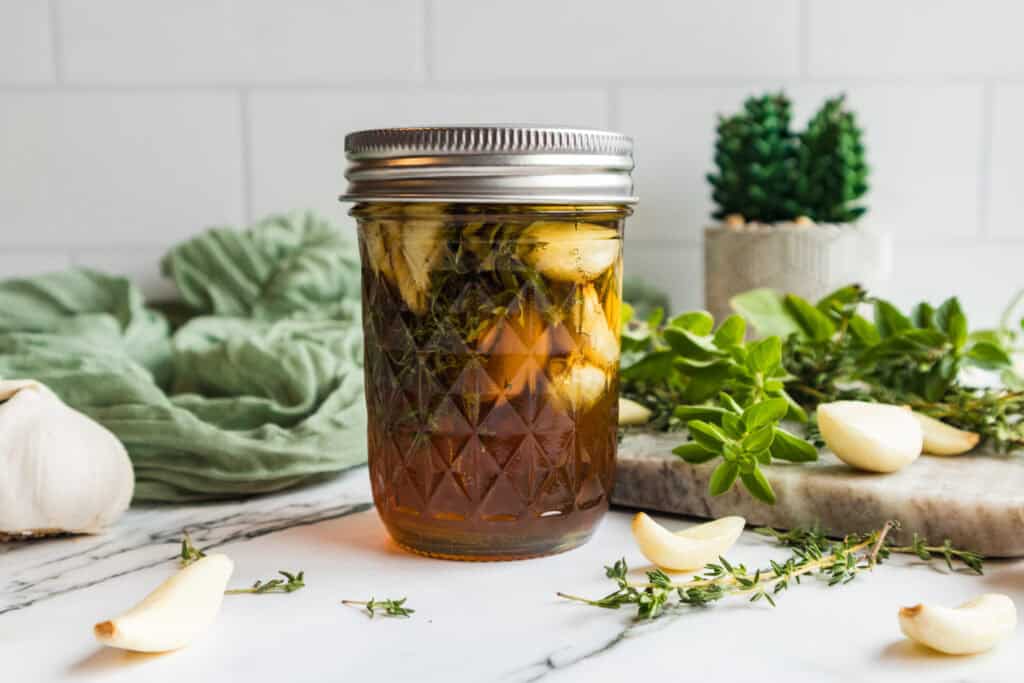 homemade garlic infused honey in a glass jar