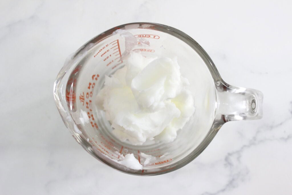 melting the tallow in glass container