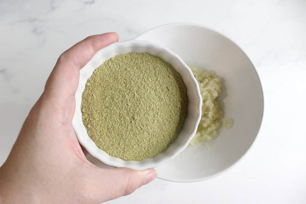 Adding the rosemary to sugar