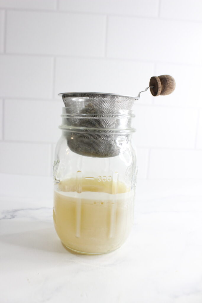 straining lavender from beeswax