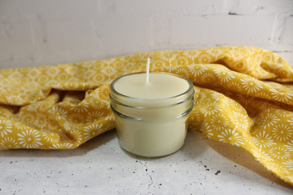 DIY Soy Candle with a yellow towel in background