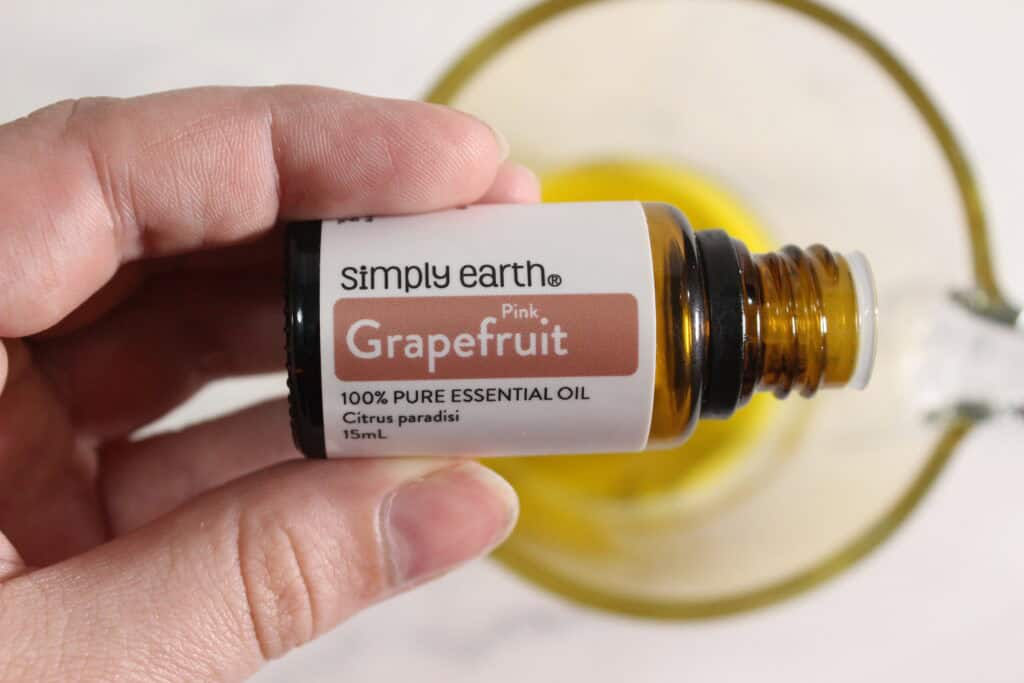 adding the essential oil to soap
