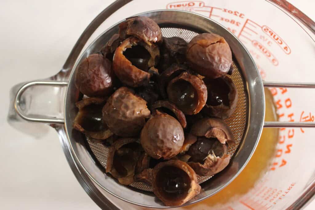 straining the soap nuts