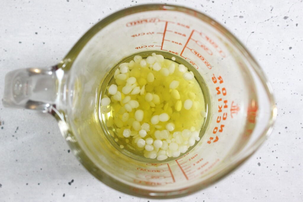 Melting beeswax and infused oil