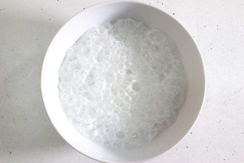 the mixture in a glass bowl fizzing