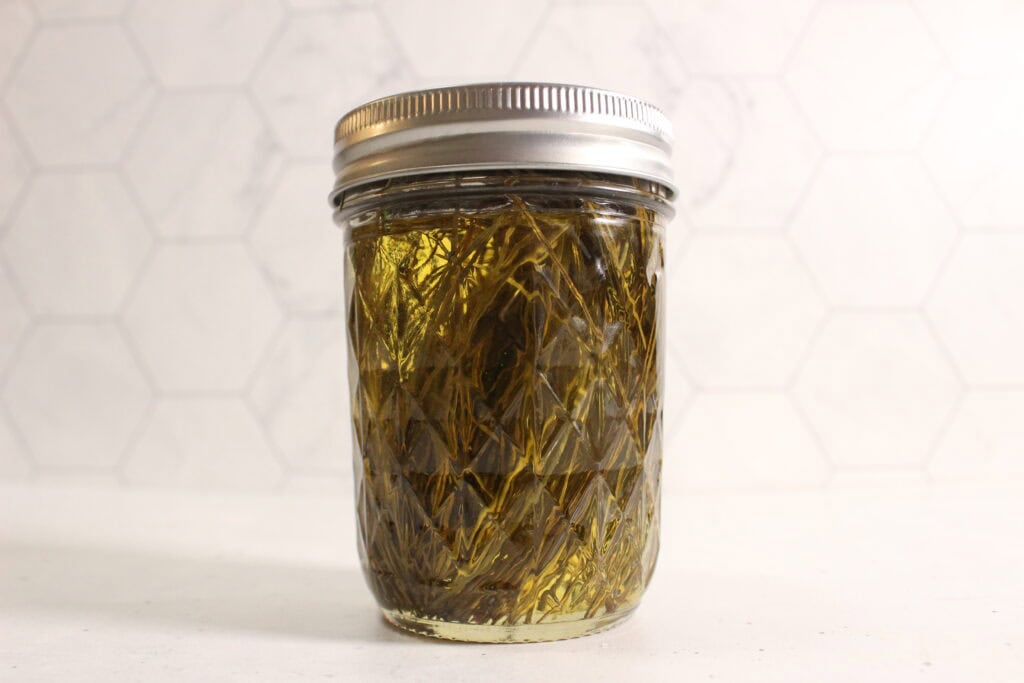 pine needles infusing in oil