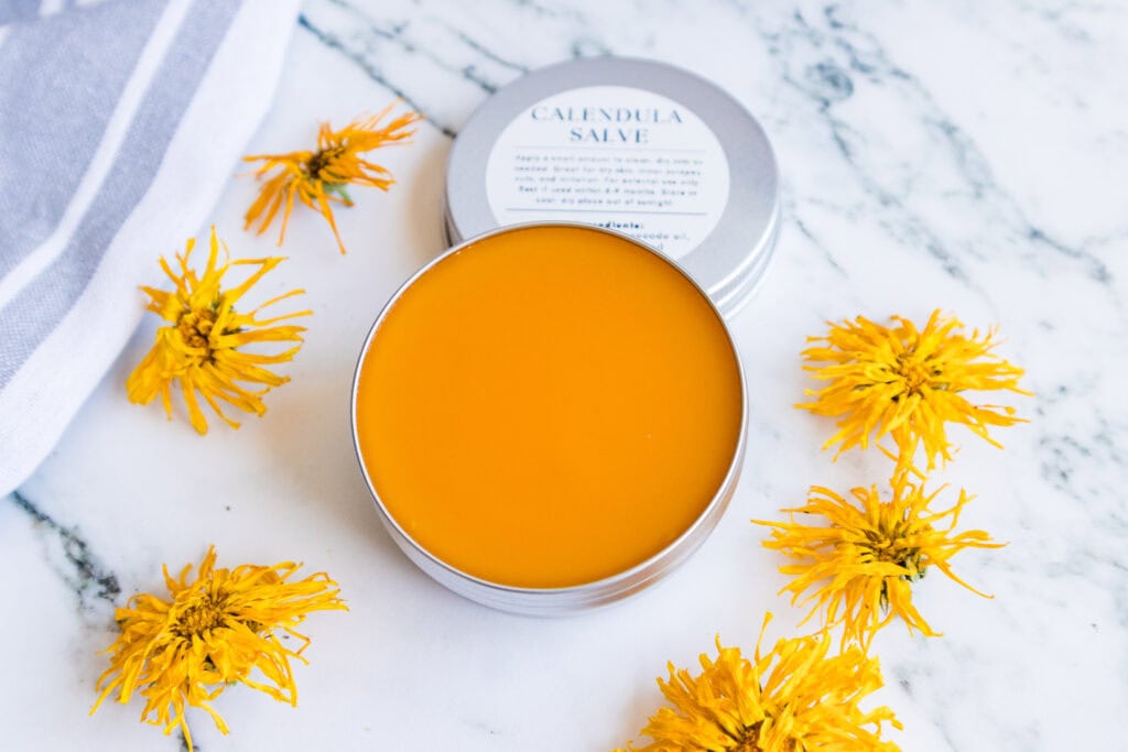 homemade calendula salve on counter