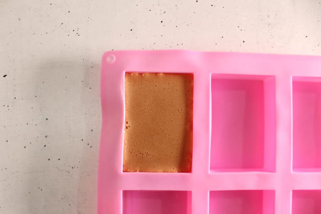 pumpkin spice soap in a soap mold