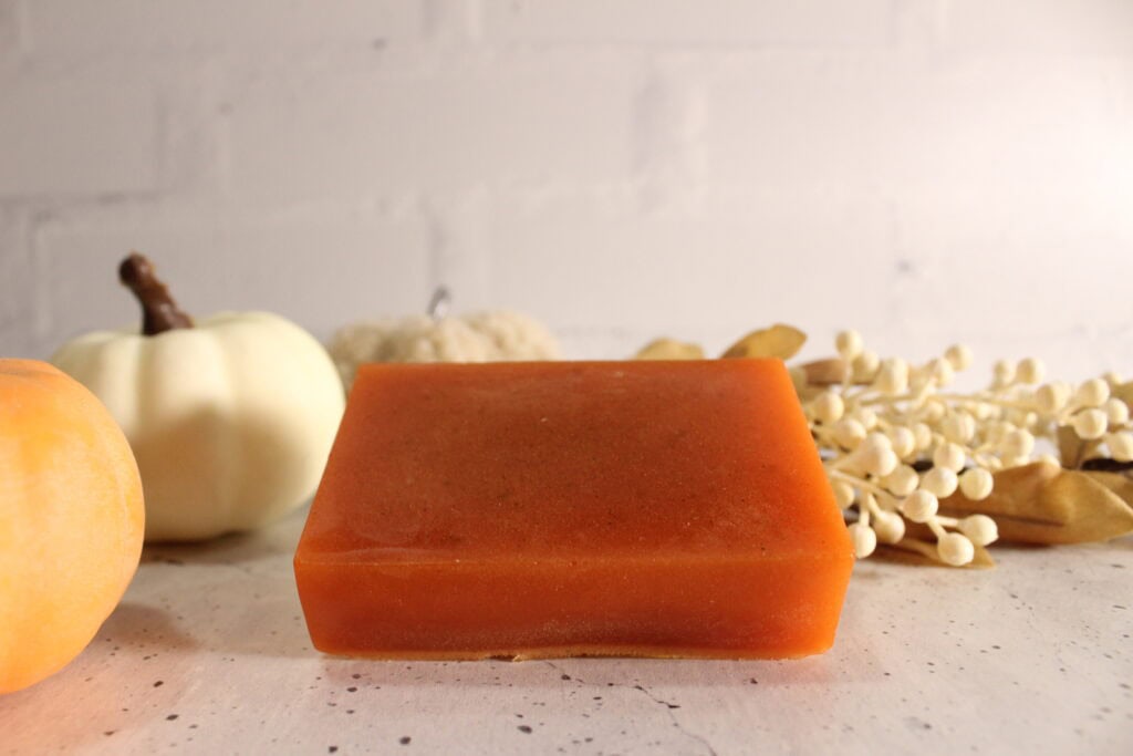 pumpkin spice soap next to pumpkins