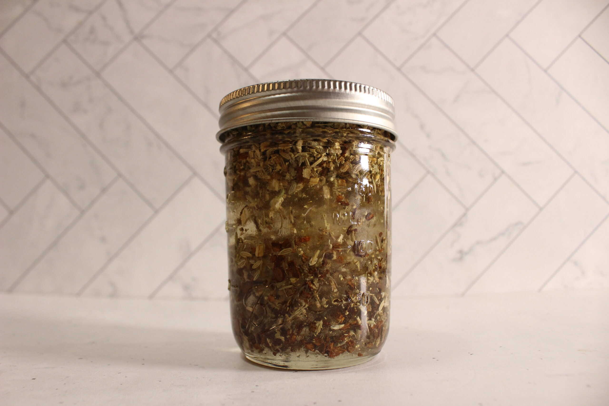 All ingredients in a jar infusing for the herbal extract