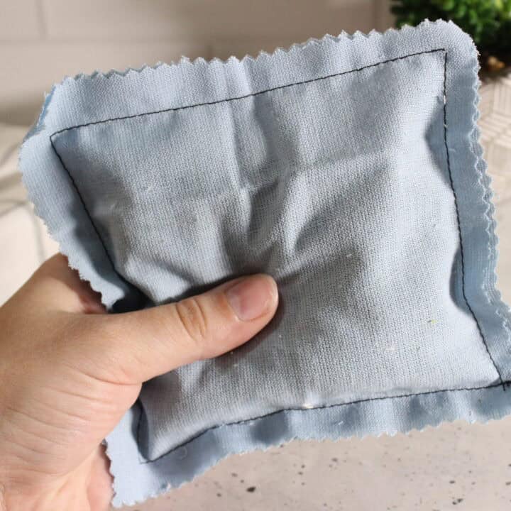 me holding up dryer sachet