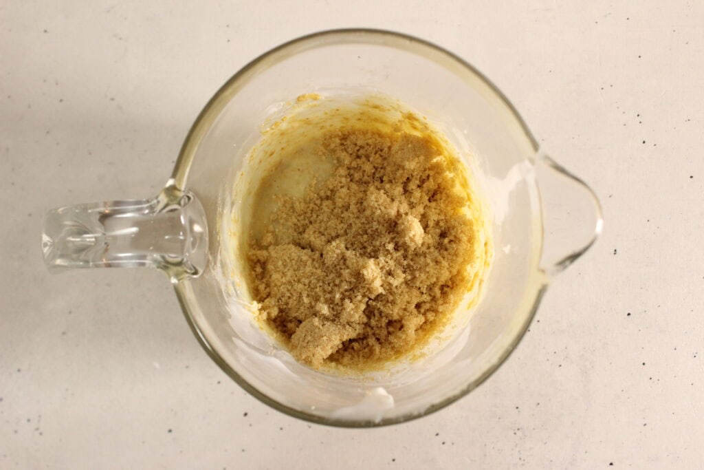 adding sugar and pumpkin powder