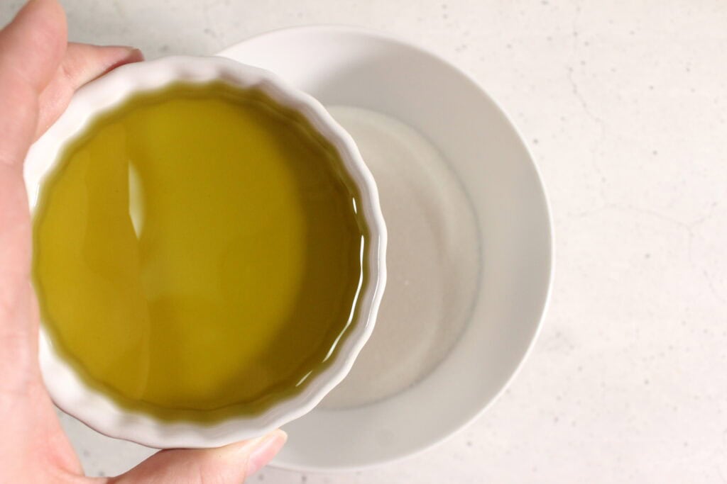 Pour the oil mixture into the sugar.