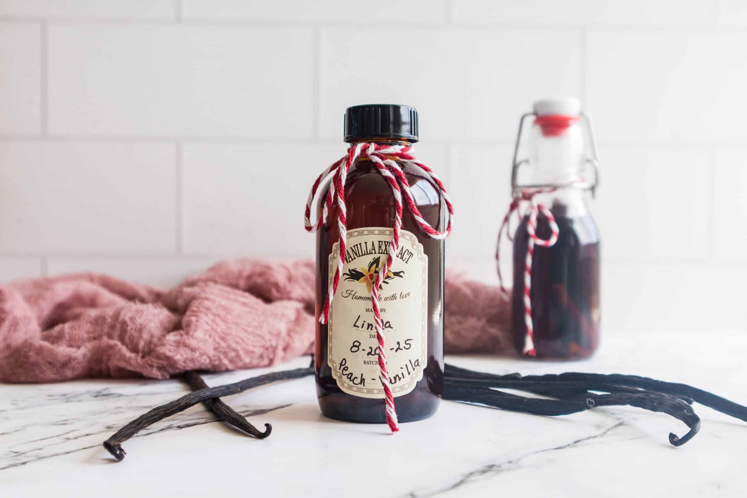 Homemade Vanilla Extract in amber bottle with bow on it