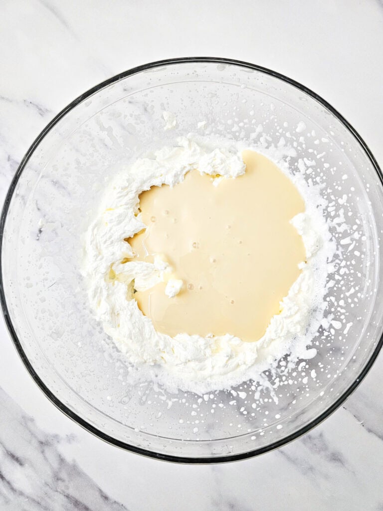 Delicious honey lavender ice cream mixture in a glass bowl, ready to be frozen for a refreshing home.