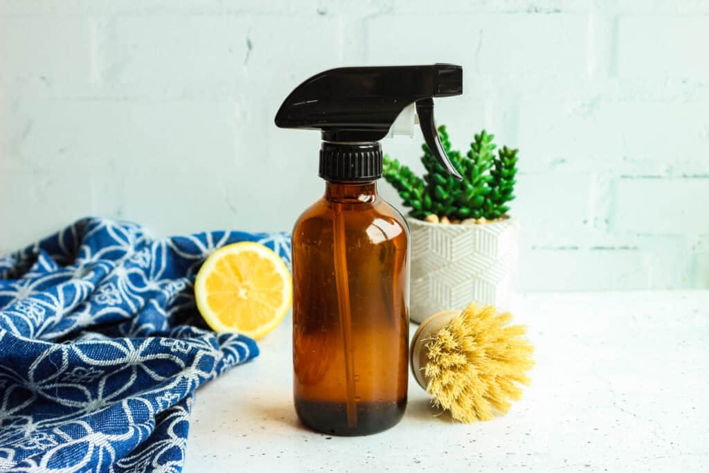 Spray bottle with stainless steel finish for homemade fingerprint-resistant cleaning solutions.