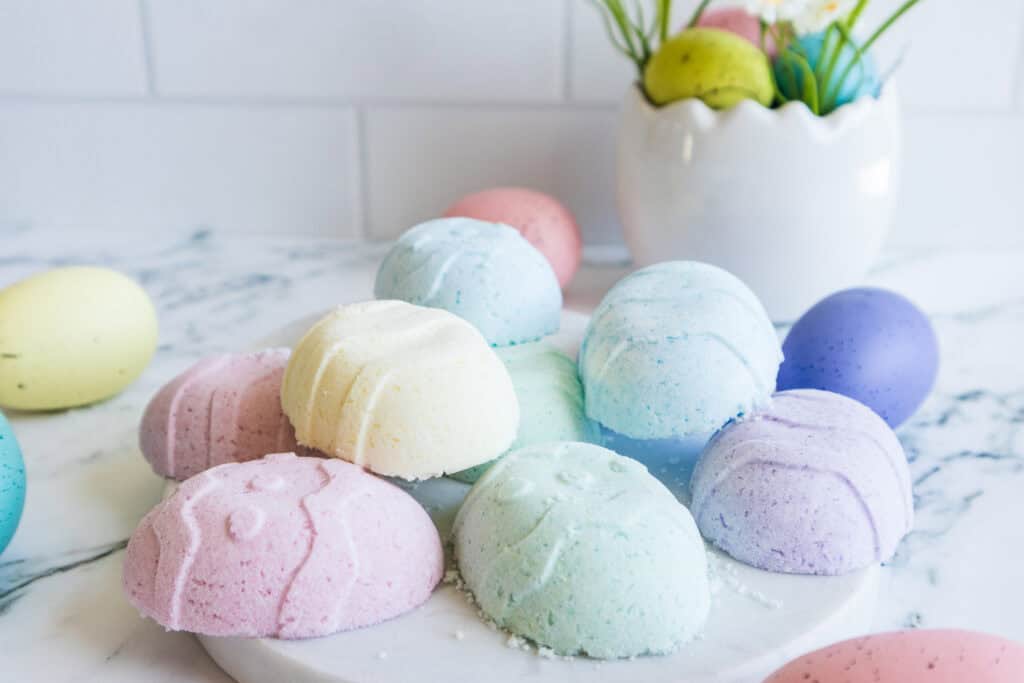 Easter Egg Bath Bombs all on a marble easter egg on the counter