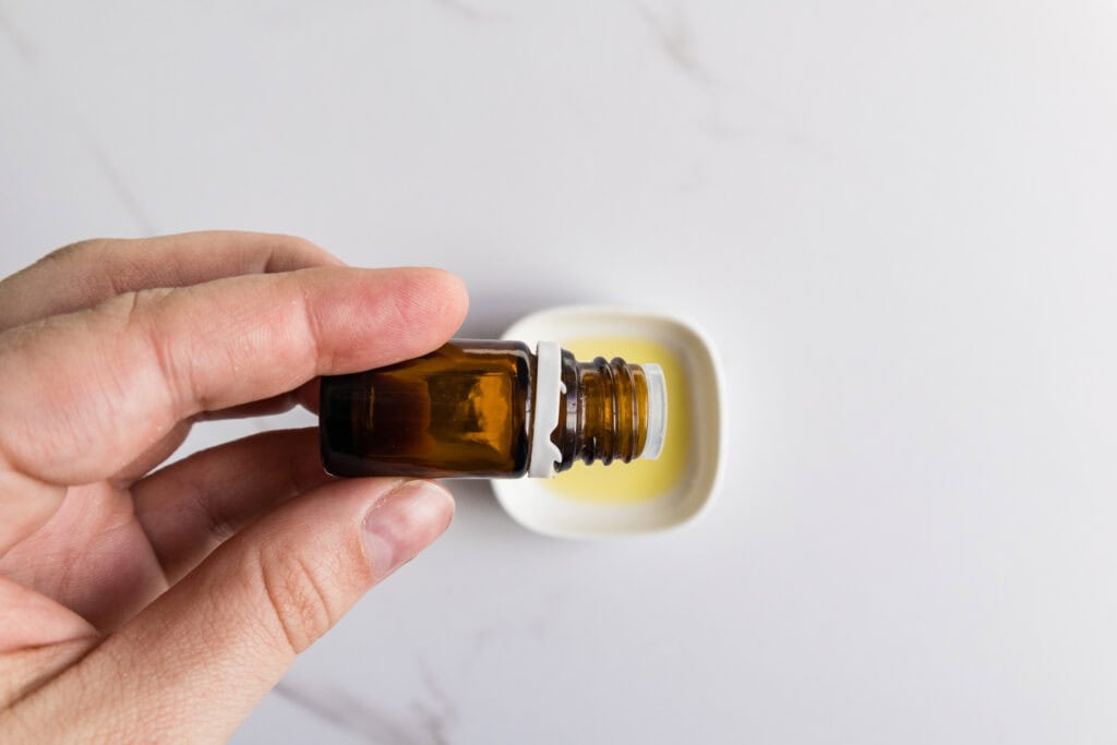 adding in the essential oil to carrier oil