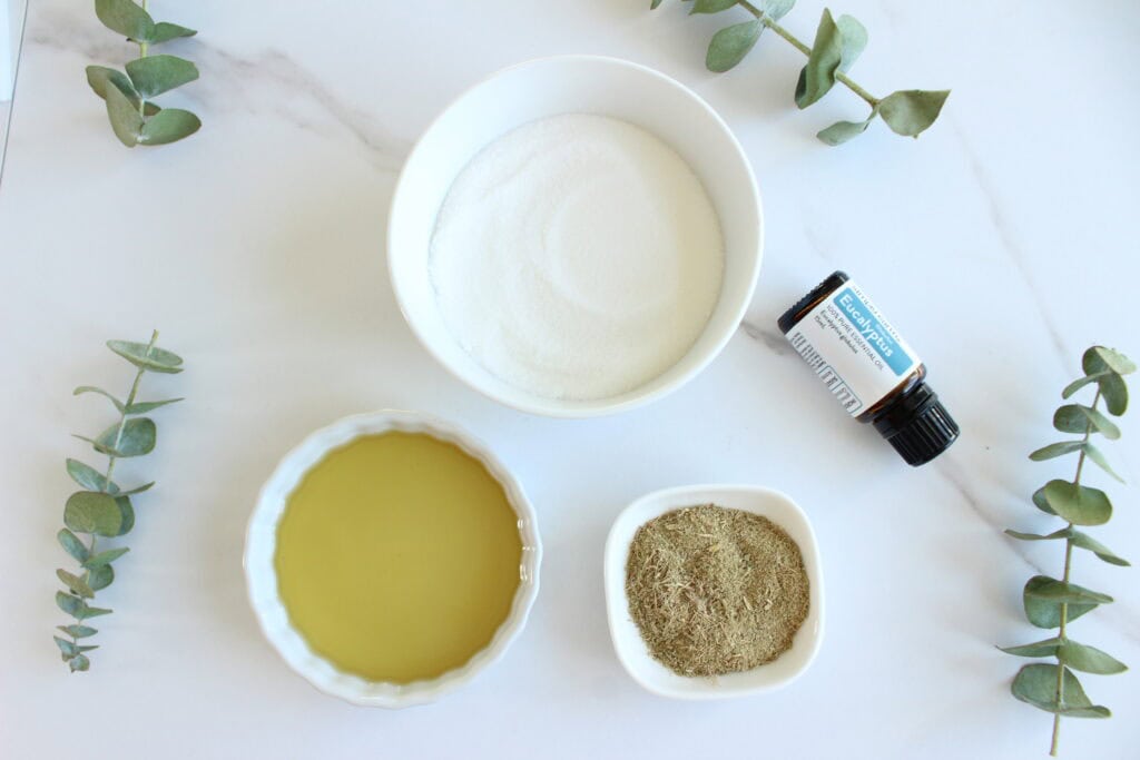 Eucalyptus essential oil, sugar, and carrier oil for DIY scrub.