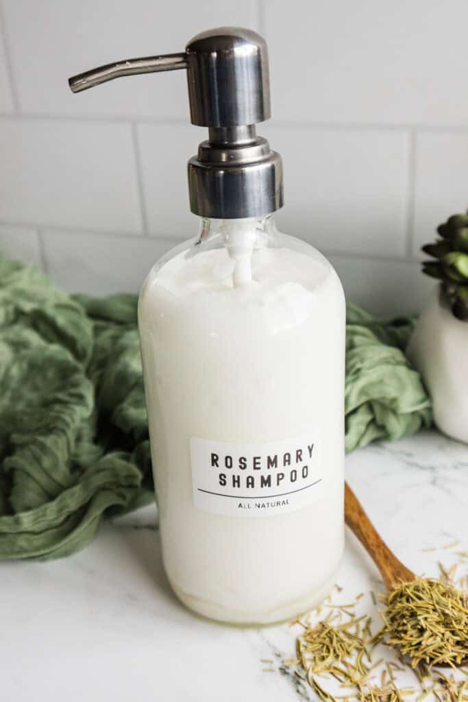 Rosemary shampoo bottle for natural hair and scalp cleansing, eco-friendly hair care product.