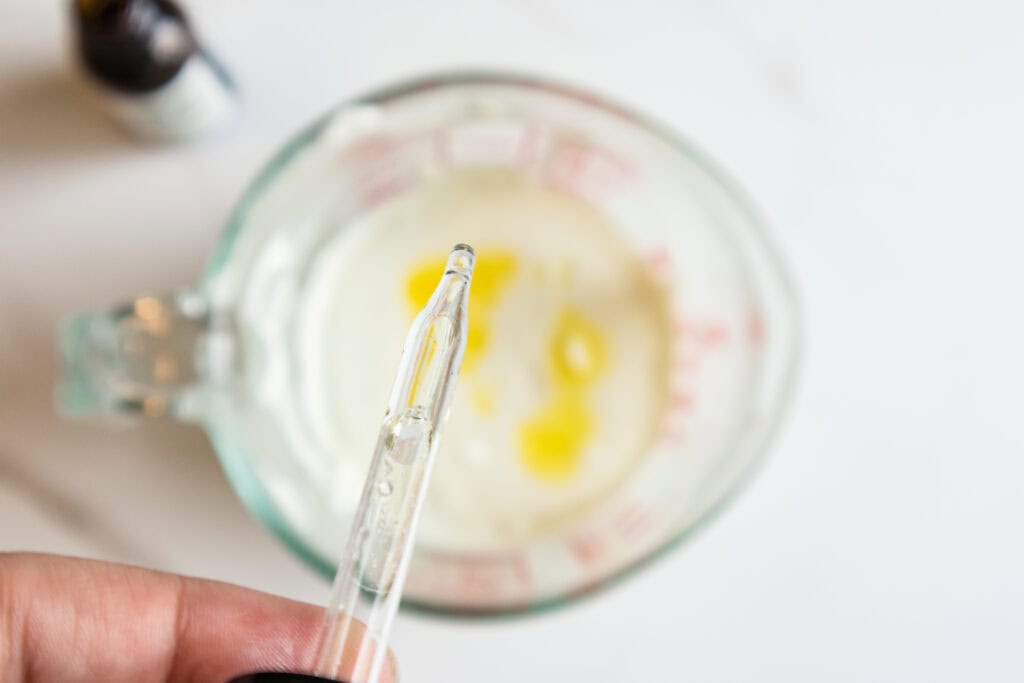 Measuring tallow and ingredients for DIY lotion recipe.