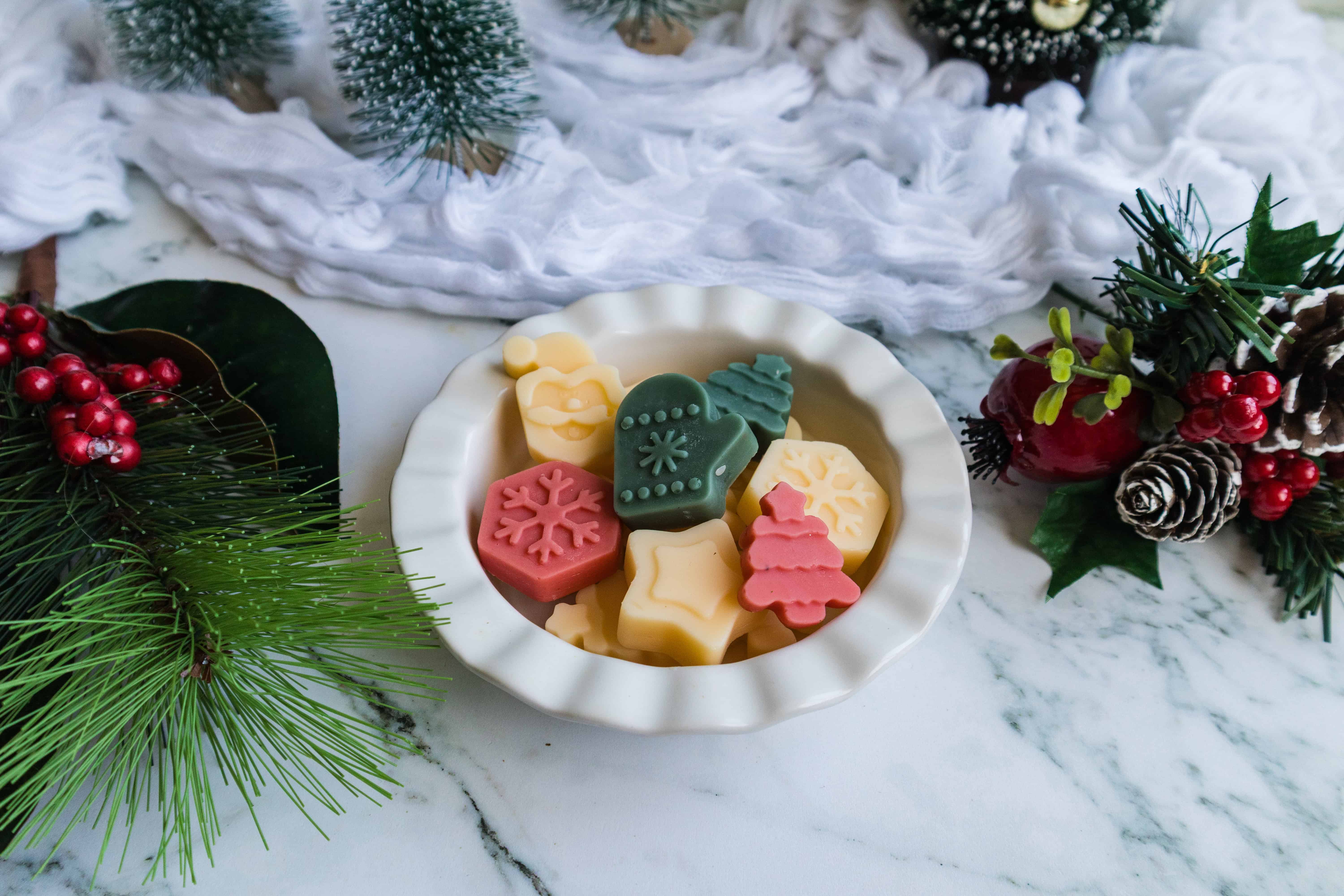 Christmas lotion bars in a white bowl.